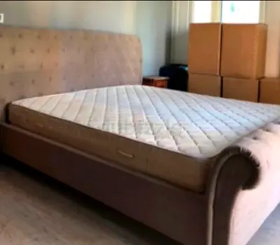 King size  fabric upholstered bed frame with mattress - used, good condition. Mattress included.