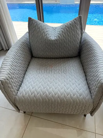 Light grey quilted armchair with cushion - good condition