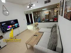 Luxury one-bedroom apartment with a balcony and open views. Ajman City Tower. Fully furnished, avail