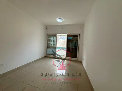 Free air conditioning, spacious two-bedroom apartment with a living room and balcony, great view, large area, easy access to Dubai, for rent in Al Maj