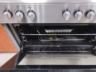 Used stainless steel freestanding gas oven with 5 burners - good condition