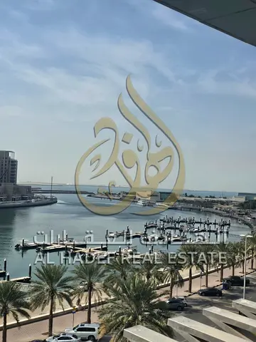 Available in Sharjah (Al Khan area): two master bedrooms with wardrobes and a balcony overlooking the lake, plus a maid's room and free parking.