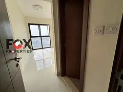 2BR apartment for annual rent in Al Alia, Ajman. Brand-new building, first tenant, 3 baths, large sp