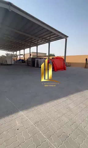 Land for sale in Al Sajaa, measuring 20,000 sq ft. The land includes two bedrooms, two bathrooms, and a kitchen.