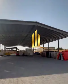 Land for sale in Al Sajaa, measuring 20,000 sq ft. The land includes two bedrooms, two bathrooms, an