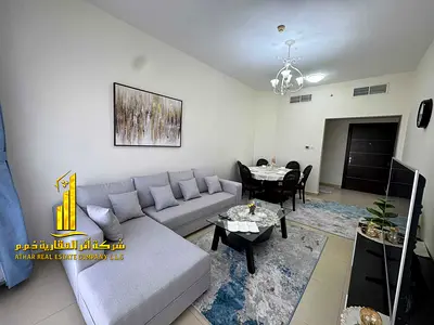 Second tenant, luxurious and elegant two-bedroom apartment with a fully furnished living room, available for monthly rent in Al Jurf 2, Al Yasmin Towe