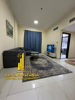 Luxury apartment, second occupancy, two bedrooms, living room, and open balcony. Ajman, Al Muwaihat.