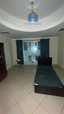 Two bedrooms and a living room in Al Qasba; explic
