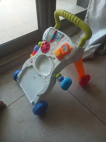Baby walker with activity tray and music - used in good condition