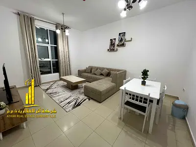 Luxury apartment, second occupancy, two bedrooms, living room, and open balcony. Ajman City Tower. Fully furnished, for monthly rent.