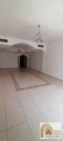 Apartment for annual rent in Al Taawun. The apartment has 3 bedrooms, a large living room, a large hallway, 3 bathrooms, built-in wardrobes, and air c