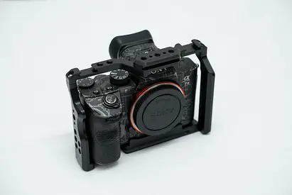 Sony Alpha A73 mirrorless camera body in protective cage (no lens) - good condition