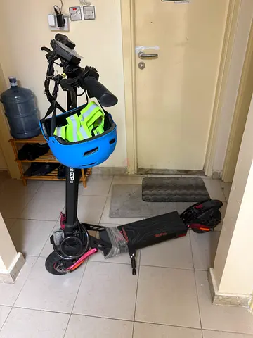 4 month old electric scooter with helmet - very good working condition.