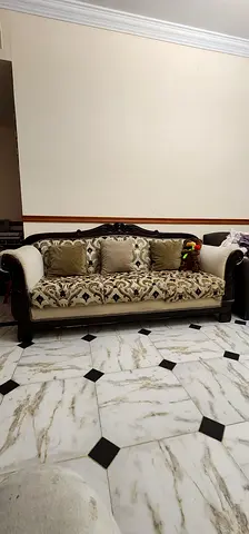 Classic carved wooden 7-seater sofa with cushions - good condition