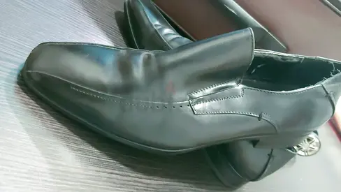 Black leather formal slip-on men's shoes, used