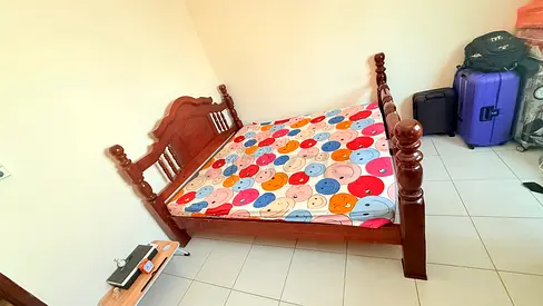 Wooden cot with bed