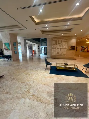 Luxurious 2BR (Master) + Hall for annual rent in Concord Tower, Ajman. Balcony with city & Creek views, free parking, 4 payments.