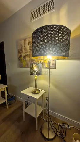 Pair of matching floor and table lamps with perforated blue shades