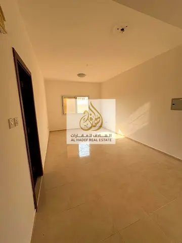 Annual rent in Al Jurf 2, next to Woodlam American Private School, Ajman University, and Al Afaq University College: studio apartment with separate ki