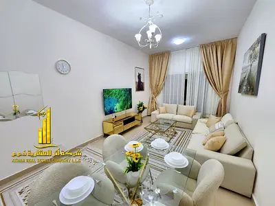 Two-bedroom apartment with a living room, fully furnished with new furniture, available for monthly rent in Ajman - Al Jurf 2 - Al Yasmin Towers