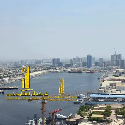 Two-bedroom apartment with a living room, fully furnished with new furniture, available for monthly rent in Ajman - Al Rashidiya 2 - Oasis Towers