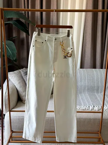 Celine White high-waist straight-leg jeans with decorative charm