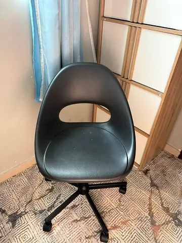 Compact black swivel chair with wheels - good condition