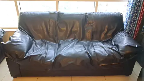 Used 8 seater, [3+3+2 seater] black faux leather sofa - some wear, good for pickup