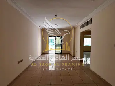 شقه غرفتين وصاله بمنطقة القاسميه الند الشارقه بلكون اطلاله مفتوحه تكييف مركزي تسهيلات بالسداد قريب من بنك المشرق