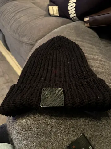 Genuine lv Black knitted beanie with metal logo plate - gently used