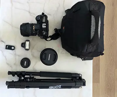 Nikon D7000 DSLR Kit with Tamron Lens, 2 Nikon Lens l, Flash ,Tripod and Bag - Excellent Condition