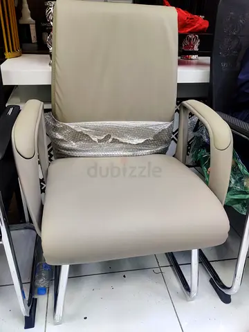 Set of 2 beige faux leather dining chairs with chrome legs