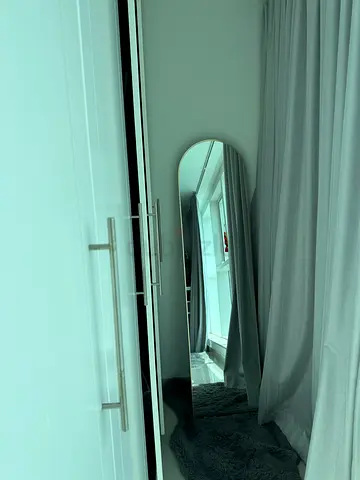 Full-length freestanding mirror with rounded top - good condition