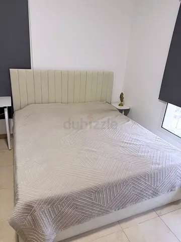 Modern Upholstered Bed with Fluted Headboard