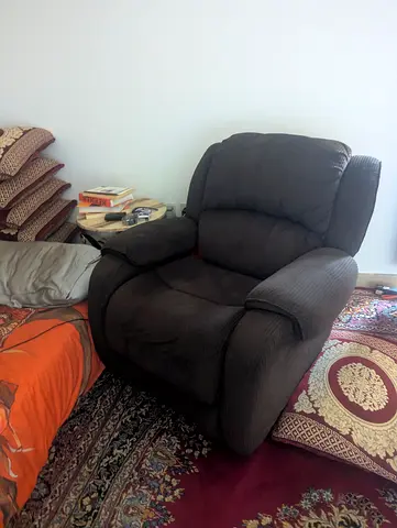 Comfortable single brown fabric recliner armchair - good condition