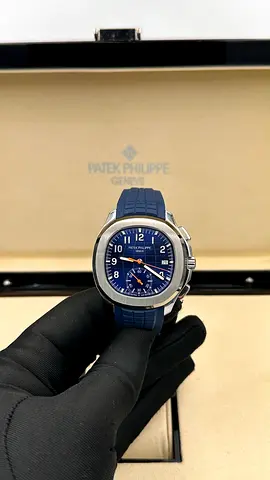 This is likely a Patek Philippe Aquanaut Chronograph, recognizable by its blue embossed dial, octago