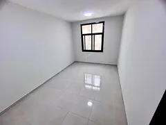A spacious 2-bedroom apartment is available for annual rent in Al Jurf 3, Ajman, behind the Chinese