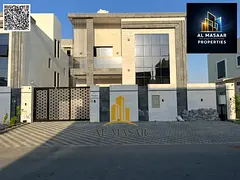 Villa for rent in Al Amerah, Ajman, featuring two floors, a roof terrace, and 6 master bedrooms; rea
