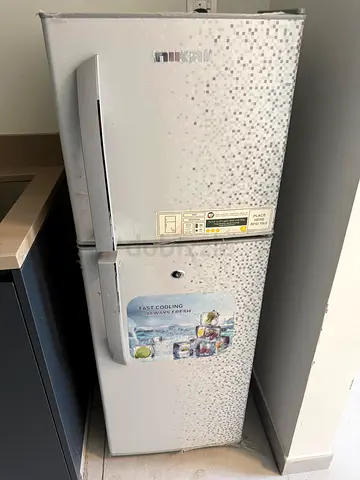 Used upright NIKAI refrigerator with separate freezer - good working condition
