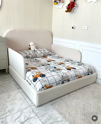 Kids low-profile toddler bed with padded headboard and side rails (like-new)