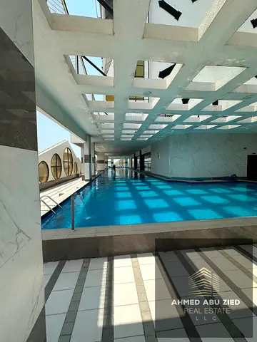 Stunning 2BR in prime Al Rashidiya 1 tower, Ajman. Spacious, balcony, central AC/gas, gym & pool. A