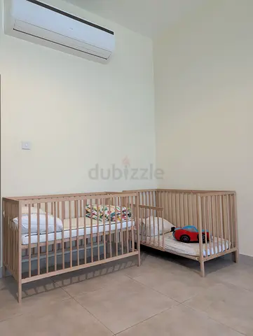 Two Pair of light wood baby cribs (used) - simple design
