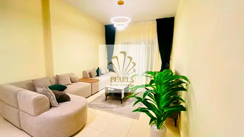 For annual rent: A luxurious one-bedroom apartment with a living room, fully furnished, in the Orient Towers. It features two bathrooms, a balcony, an