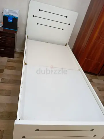 Single white bed frame with headboard — good condition