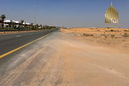 أرض تملك حر شامل رسوم بالشارقة