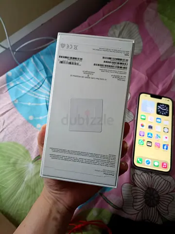 iPhone (boxed) with spare sealed box — ready to register