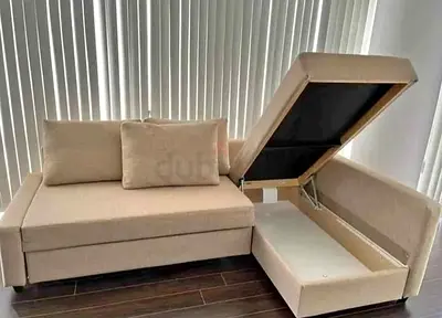 Beige L-shaped Sofa bed with Hidden Storage - Good Condition