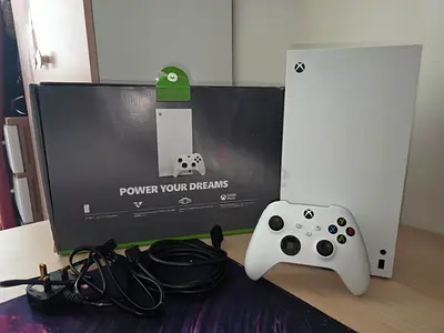 White Xbox Series x console with controller and original box.Like new