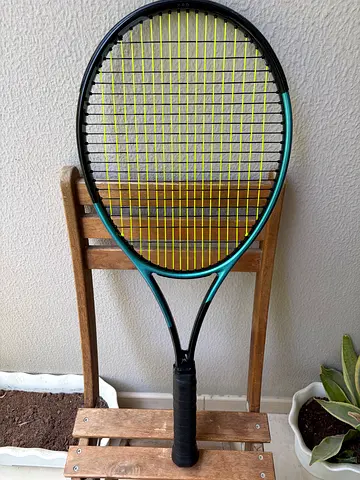 Head gravity tennis racket