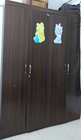 4-door wooden wardrobe in good condition - dark brown